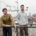 Graduate student Jared Newell, left, and Nathan Phillips on the roof of the Stone Science Building